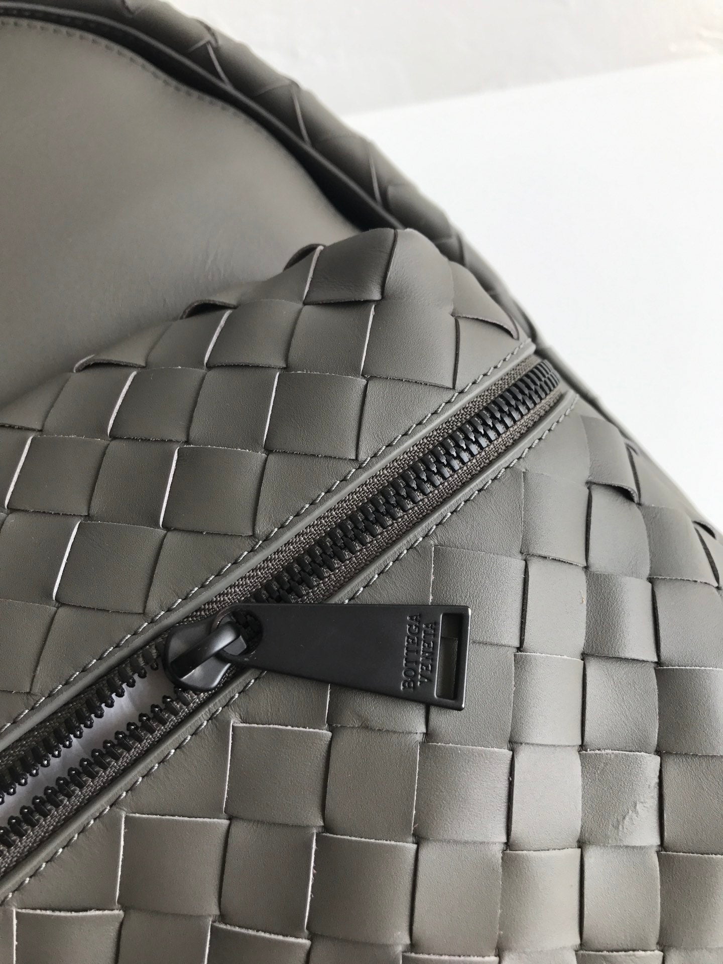 Bottega Veneta SMALL INTRECCIATO 41 BACKPACK IN CHARCOAL BLACK CALFSKIN
