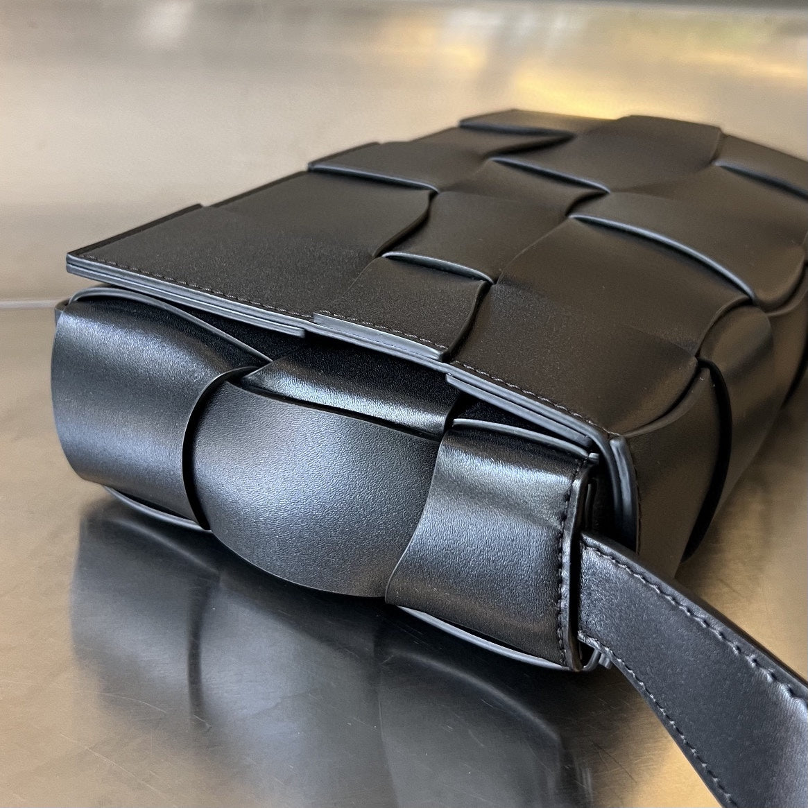 Bottega Veneta CASSETTE 23 IN BLACK CALFSKIN WITH WAVY PATTERN