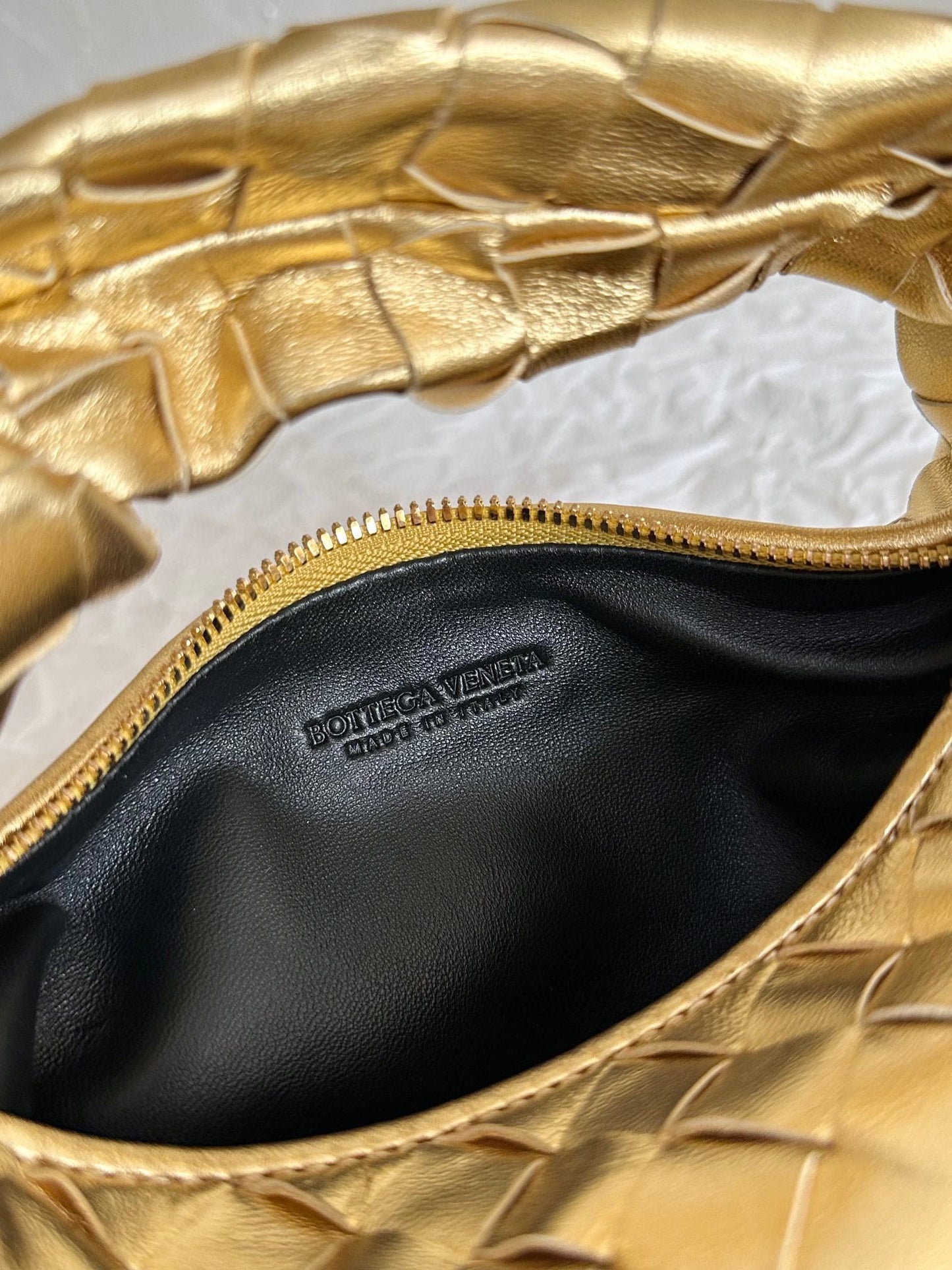 Bottega Veneta mini jodie 28 gold metalic lambskin