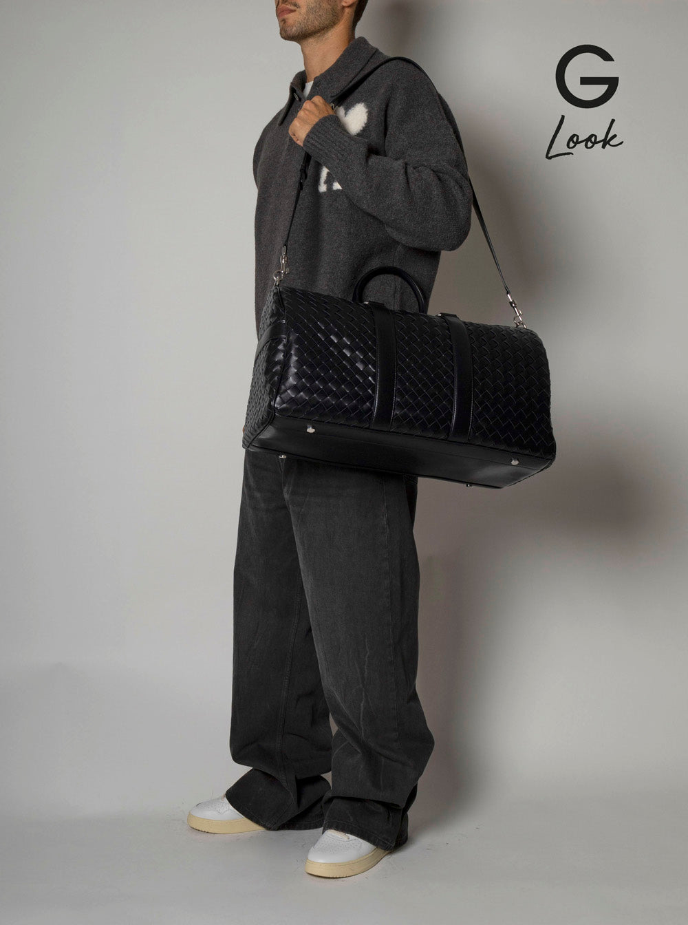 Bottega Veneta Men Black Travel Bag With Intrecciato Motif And Shoulder Strap In Leather Man